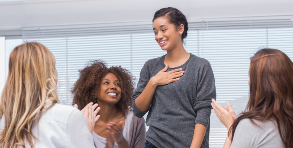 Happy patient has a breakthrough in group therapy while others are ...